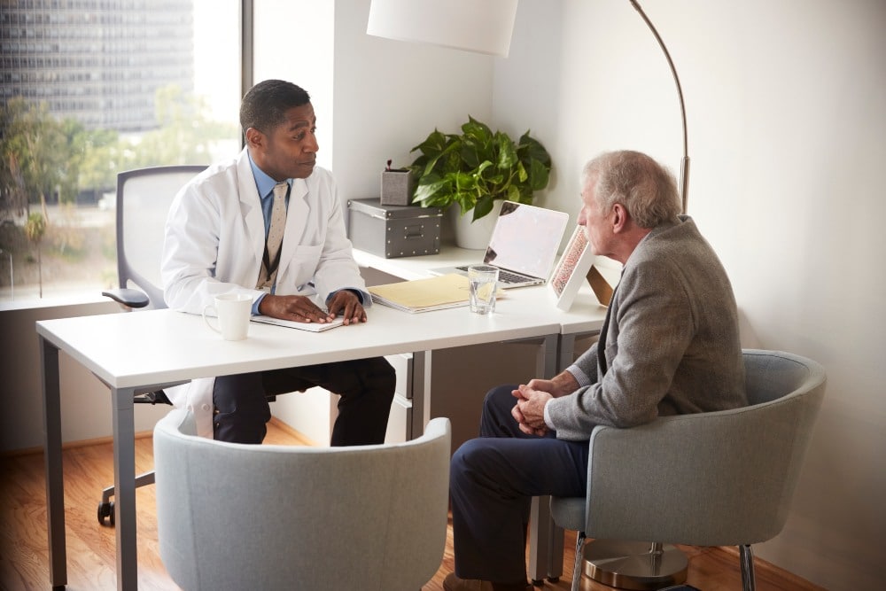 Man Having Consultation With Doctor In an Office