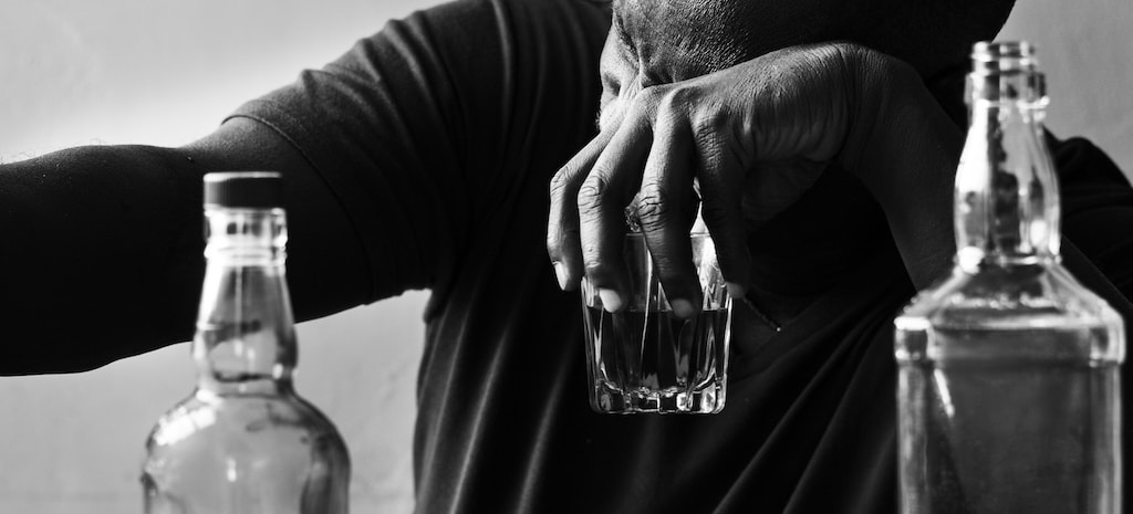 man drinking alcohol