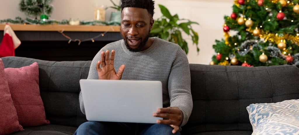 Man on virtual support group call for addiction during the holidays.