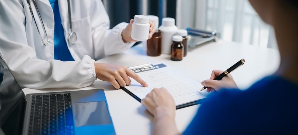 Doctors explain the use of medication to patients.