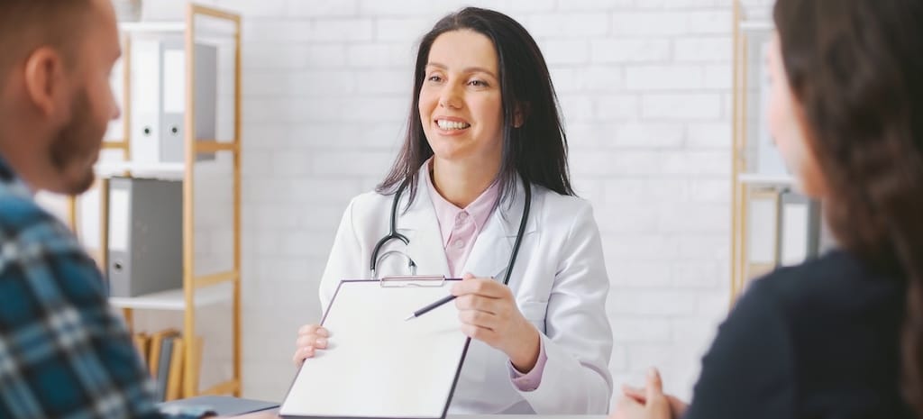 Woman discussing medications with her doctor