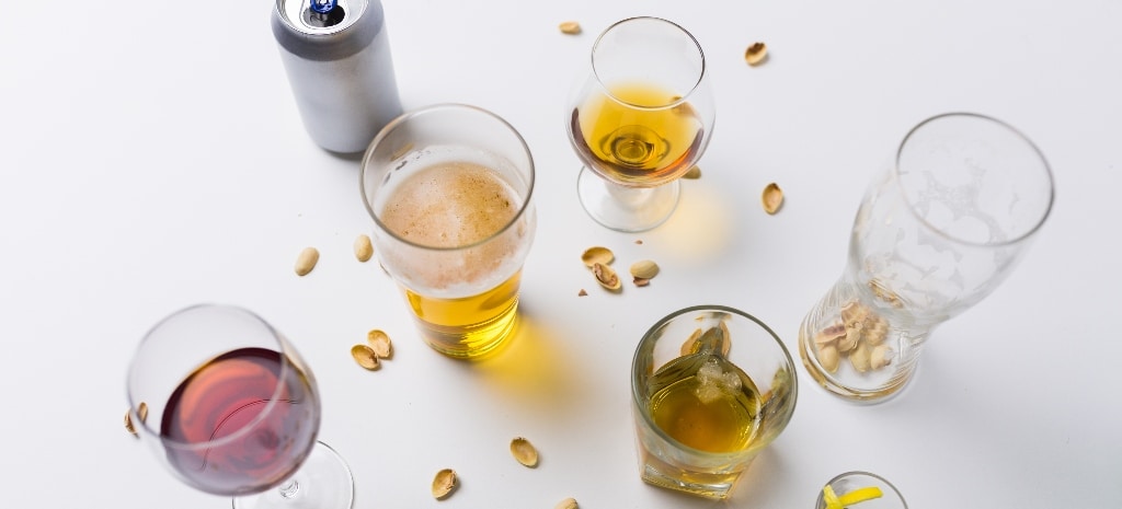 Alcohol and messy table, representing issues with alcohol use