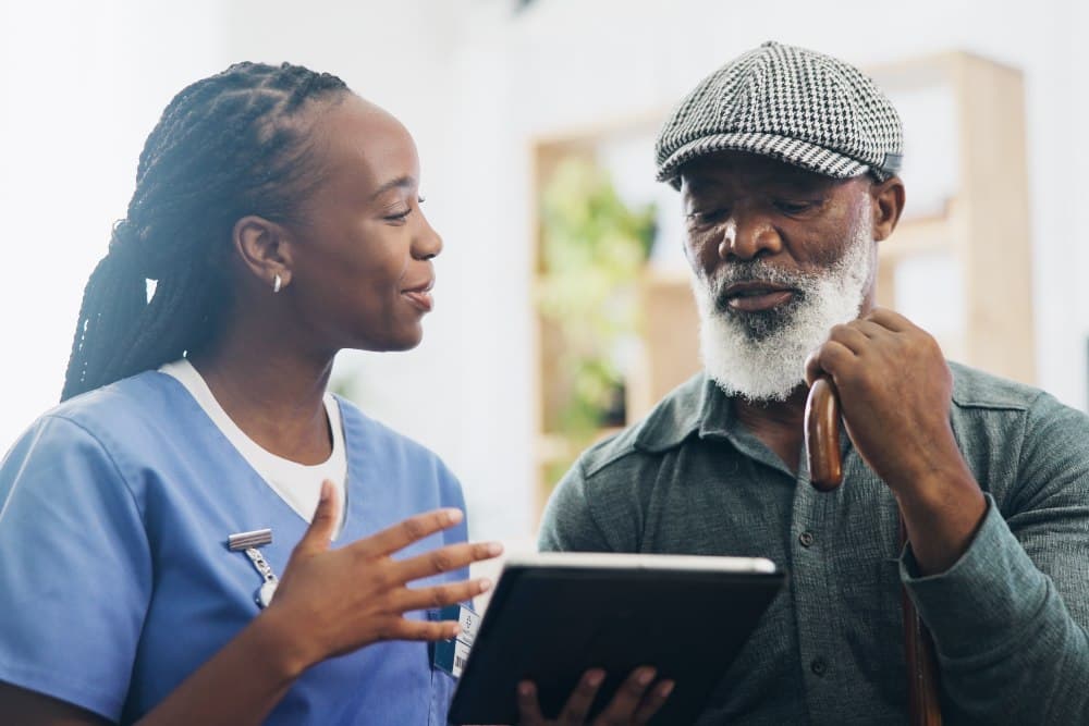 man and tablet for telehealth