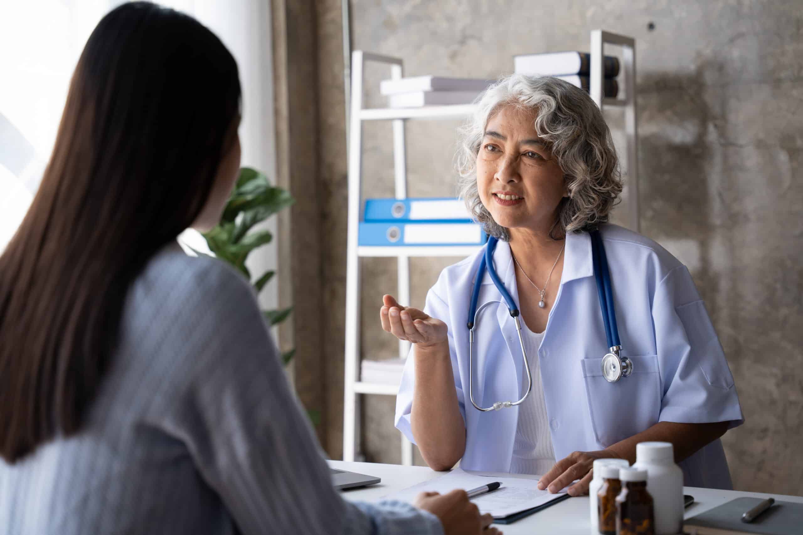 A doctor talking to someone about what to avoid when taking naltrexone.
