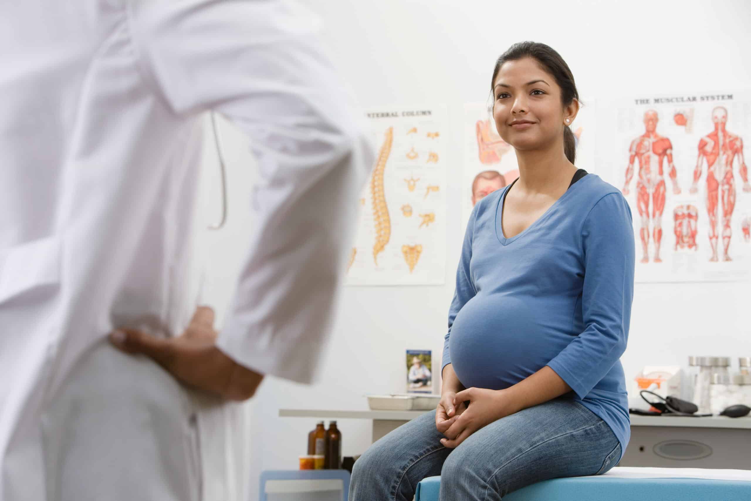 A pregnant woman in a doctor's office asking is suboxone safe for pregnancy.