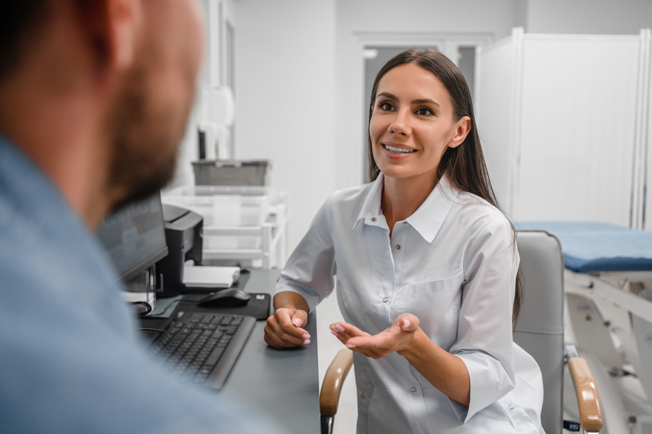 A female doctor speaking to a patient about an alternative for suboxone.